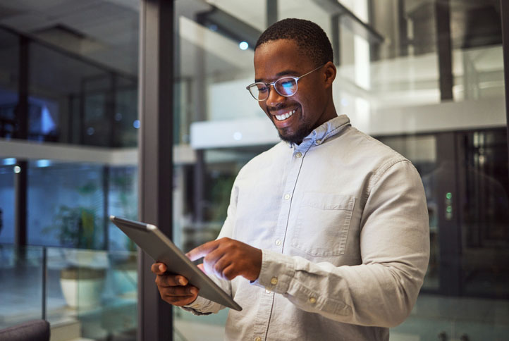 A business professional reviewing financial reports on a laptop